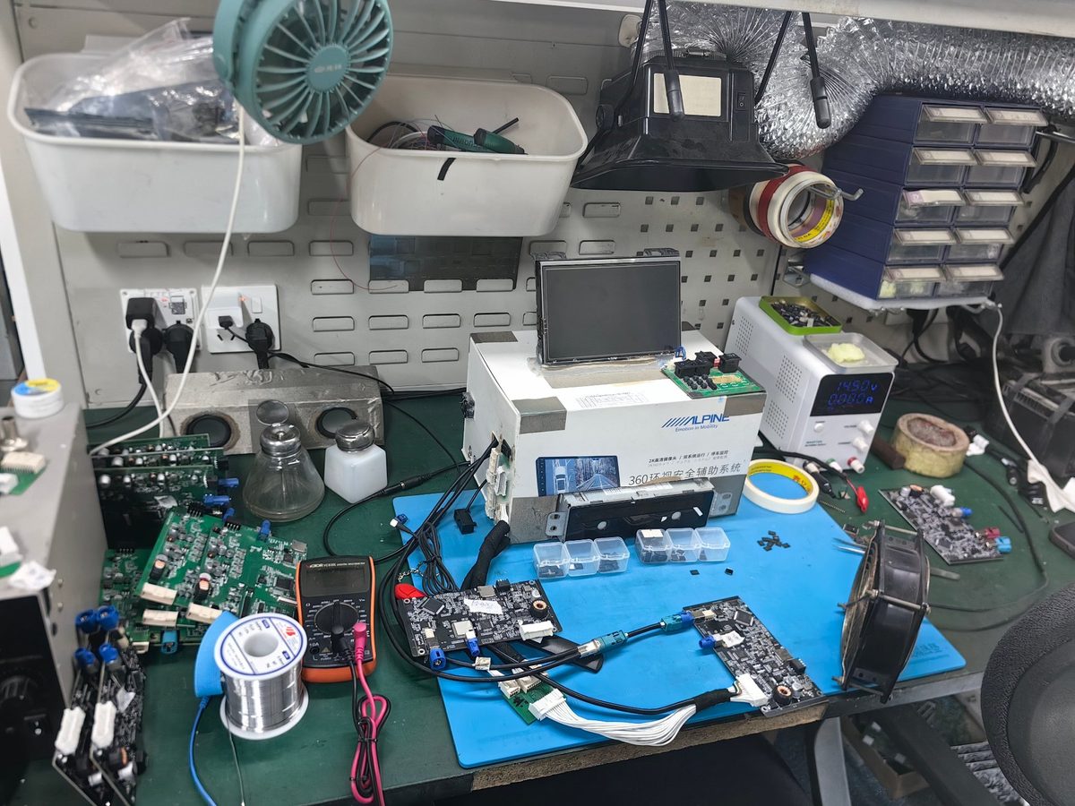 Engineer testing interface modules on a workbench